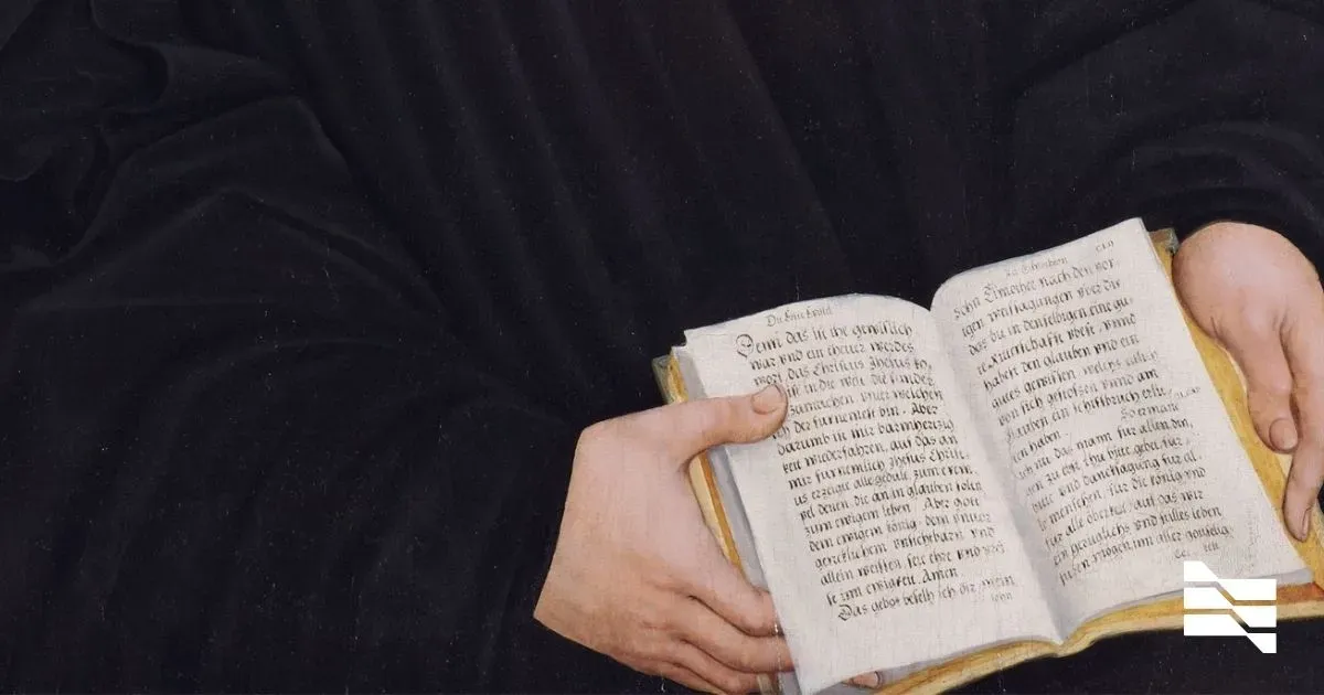 Close-up of hands holding an open book from a classical painting, a metaphor for the knowledge and life-hacking tips essential for freelancers.